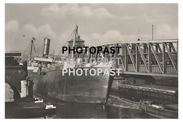 Old postcard of SS Manchester Trader Listing at Barton Swing Bridge, Manchester Ship Canal, Barton, Eccles, Manchester